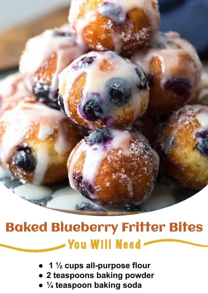 Baked blueberry fritter bites on a white plate with fresh blueberries