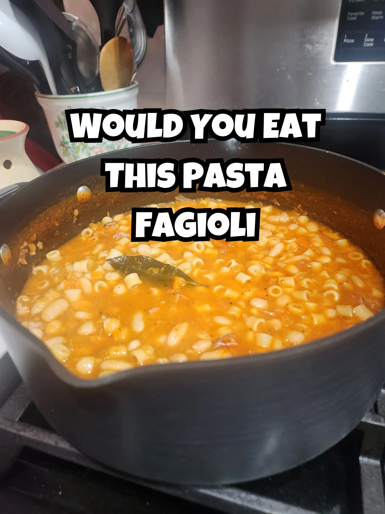 A plate of Beef and Bean Pasta garnished with herbs, a hearty and flavorful dish.