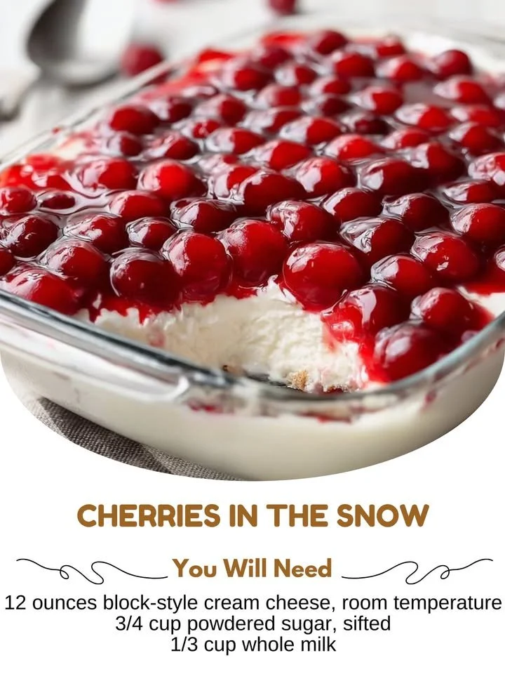 Cherries blooming in the snow, showcasing vibrant colors against a winter backdrop.