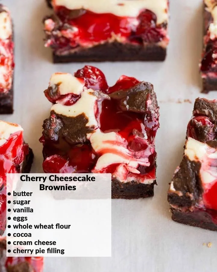 Cherry cheesecake brownies with creamy cheesecake topping and cherry garnish.