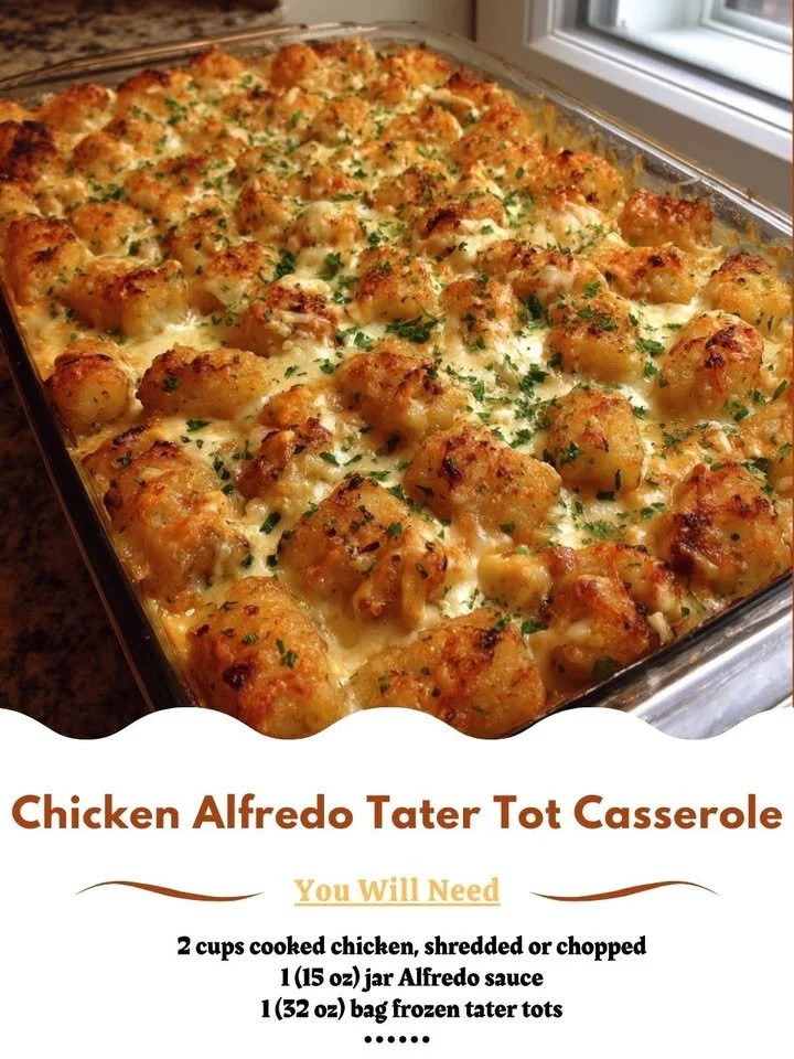 Chicken Alfredo Tater Tot Casserole topped with melted cheese and herbs