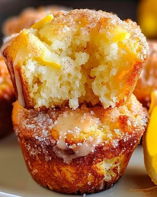 Cinnamon sugar French toast muffins with lemon twist on a plate.