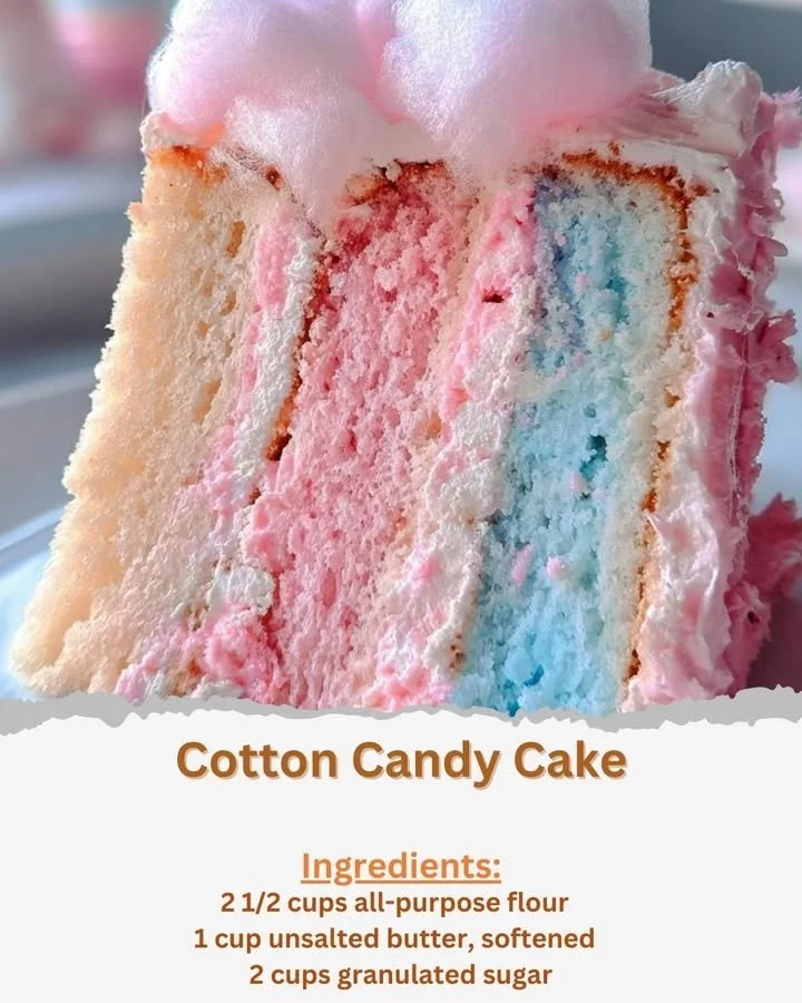 Colorful cotton candy cake topped with fluffy frosting and cotton candy.