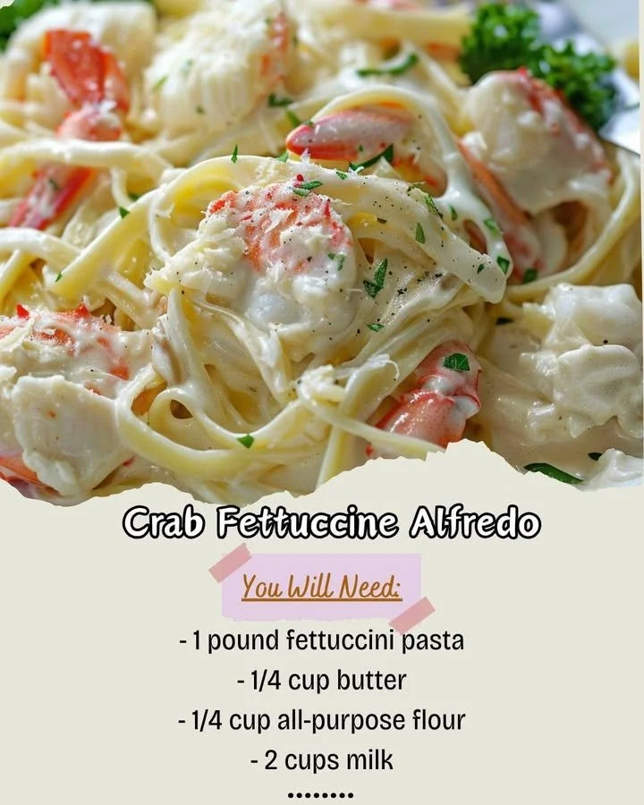 Plate of creamy Crab Fettuccine Alfredo with fresh herbs and crab meat