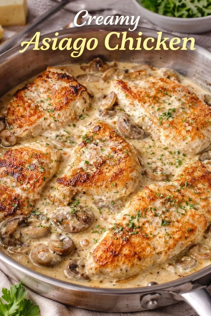 Creamy Asiago chicken served with herbs and vegetables.