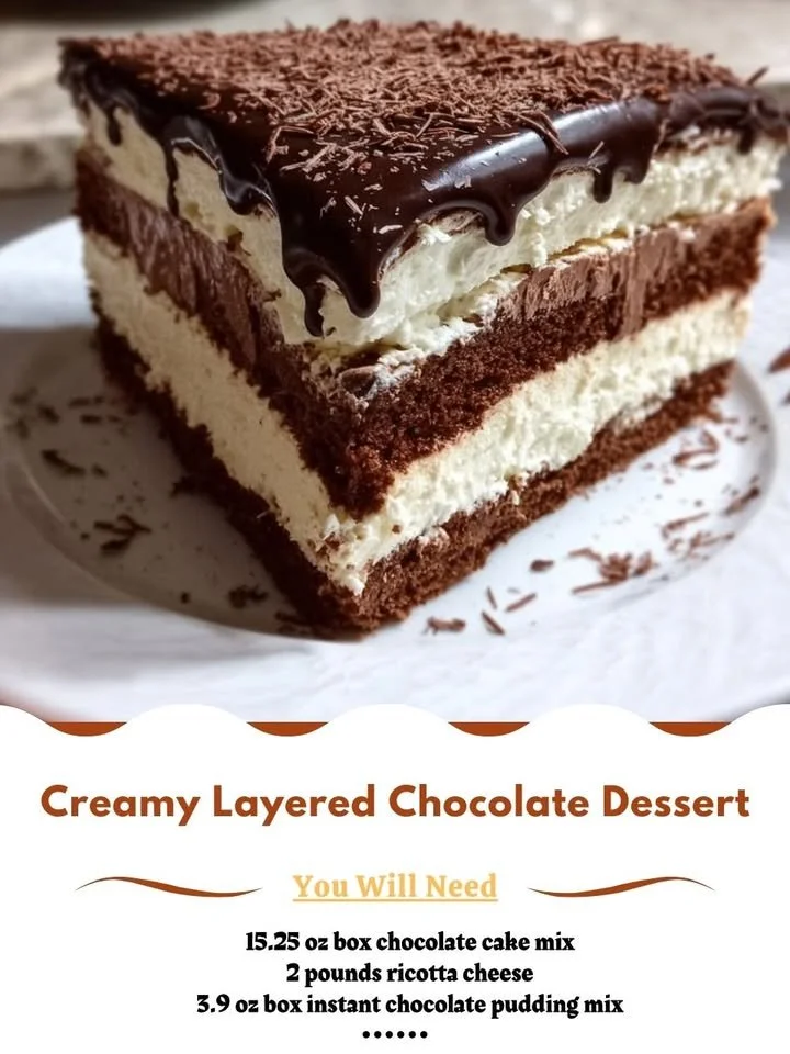 Creamy layered chocolate dessert with rich chocolate layers and whipped cream