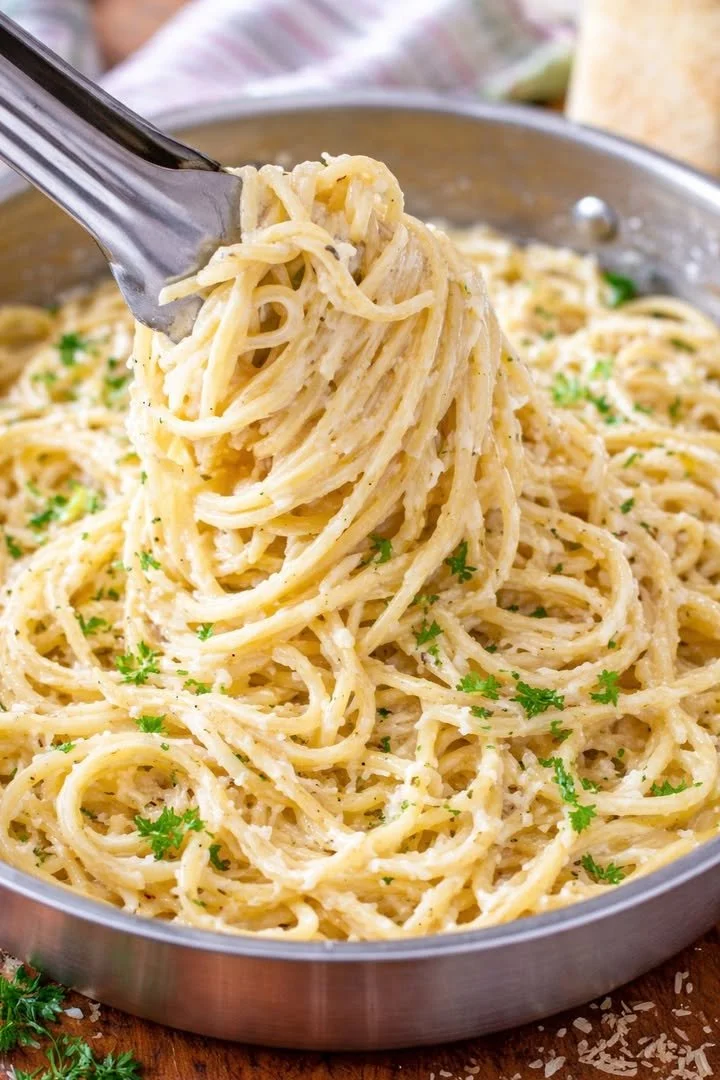Delicious Garlic Parmesan Pasta garnished with parsley and cheese