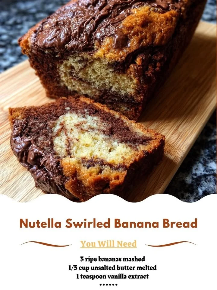 Nutella swirled banana bread fresh out of the oven, showcasing swirls of chocolate and banana.