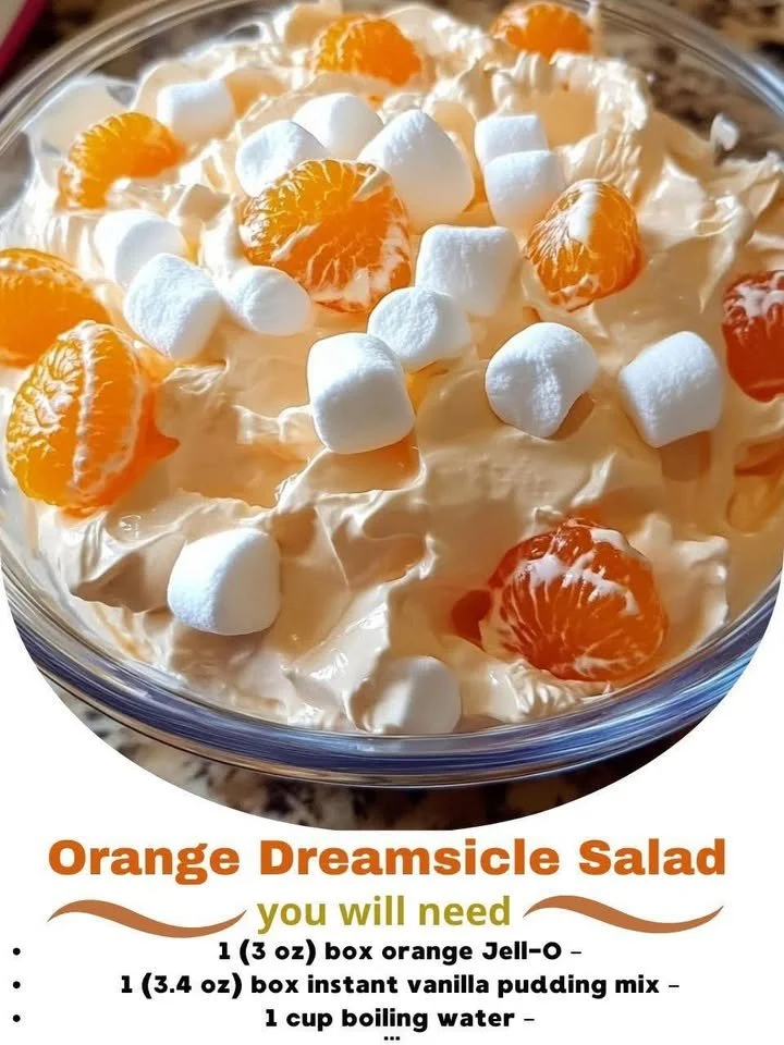 Delicious Orange Dreamsicle Salad garnished with fresh oranges and cream.