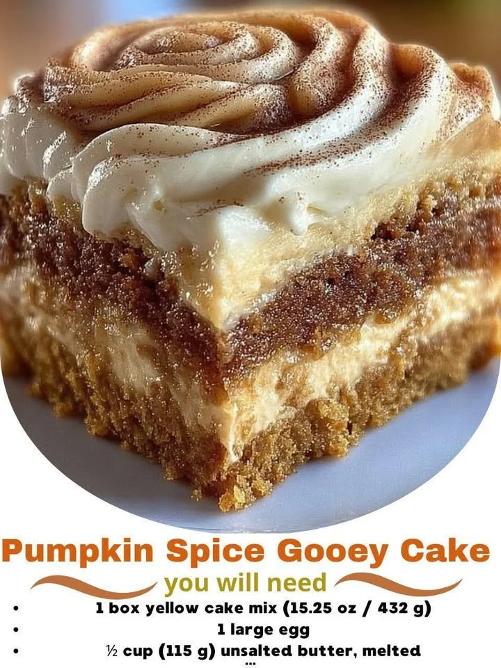Delicious pumpkin spice gooey cake topped with cream and autumn spices.