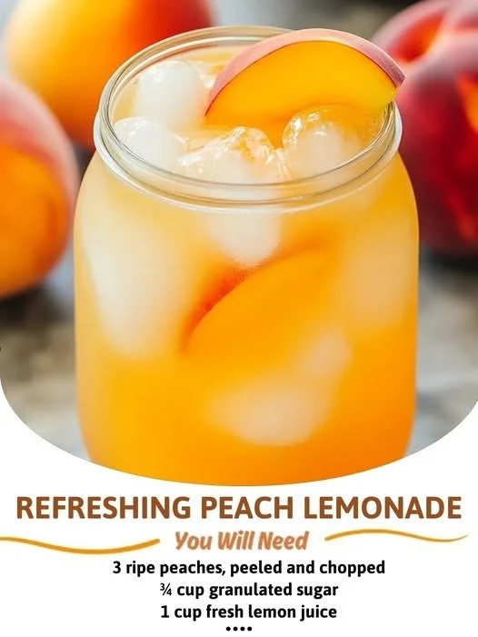 A glass of refreshing peach lemonade with fresh peaches and lemon slices