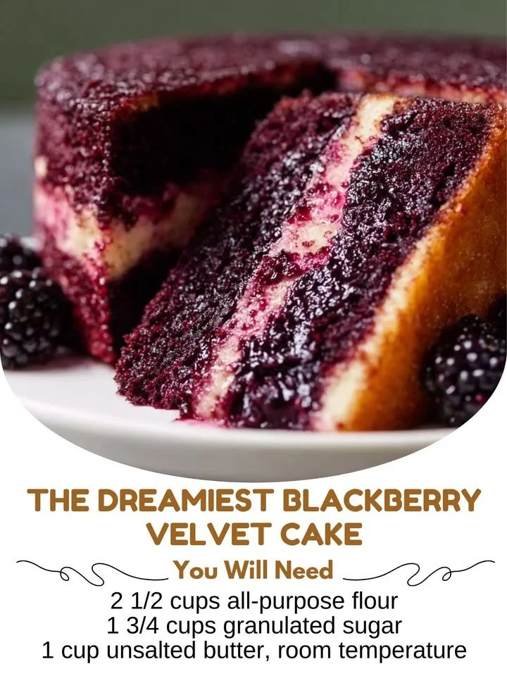 Slice of dreamy blackberry velvet cake with fresh blackberries on top
