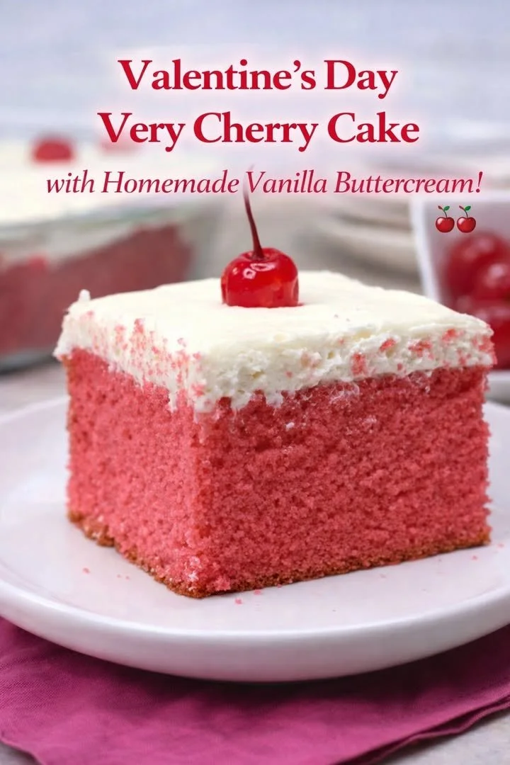 Valentine's Day Very Cherry Cake topped with cherries and heart decorations.