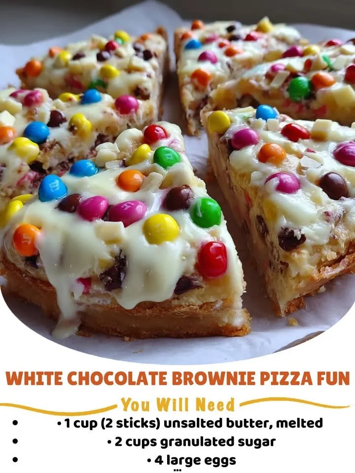 Delicious white chocolate brownie pizza topped with creamy white chocolate and drizzled sweetness.