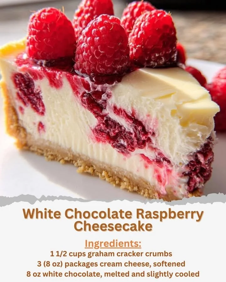 Delicious white chocolate raspberry cheesecake topped with fresh raspberries