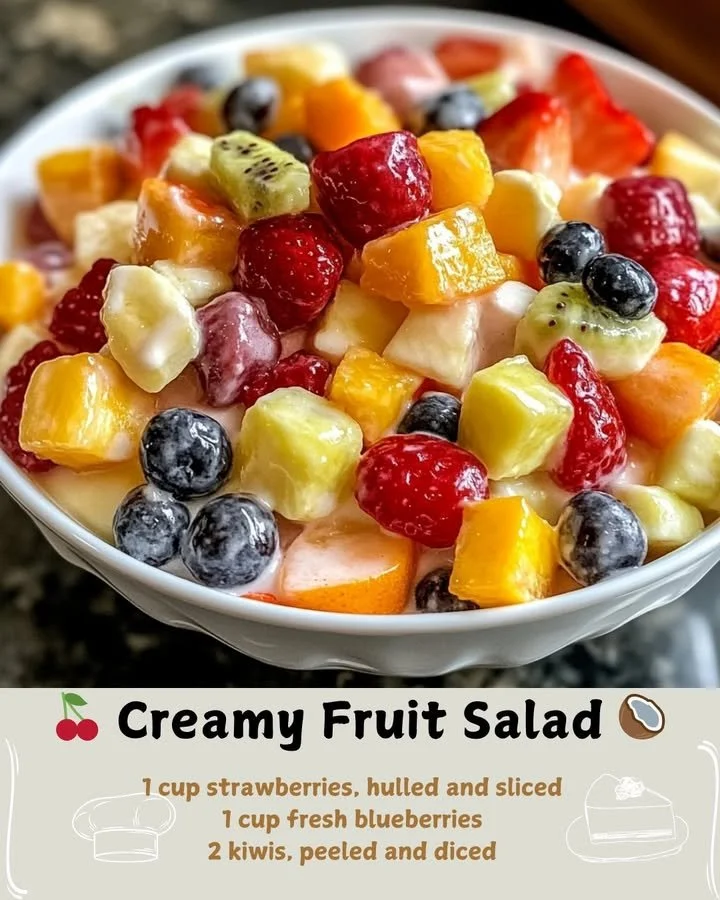 Delicious creamy fruit salad with a variety of fresh fruits in a bowl