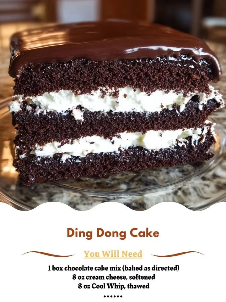 A slice of homemade Ding Dong Cake with chocolate frosting and cream filling.