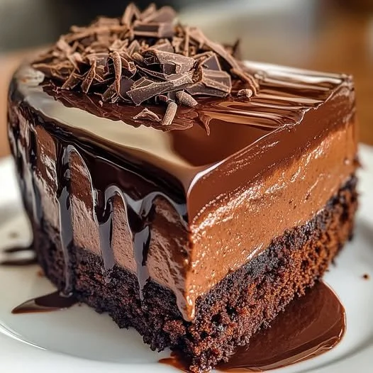 Hershey's chocolate cheesecake cake with rich chocolate frosting and creamy filling
