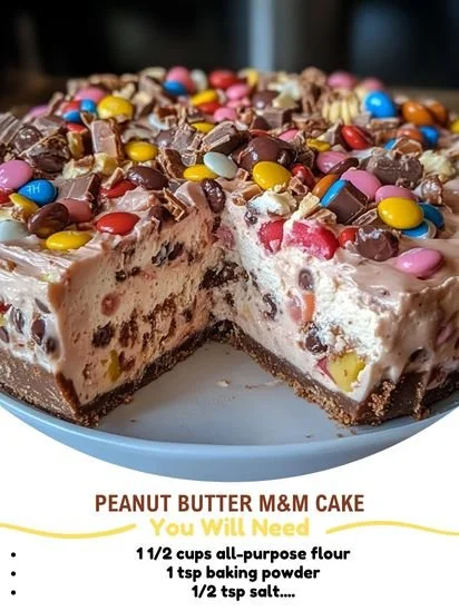 Delicious Peanut Butter M&M Cake topped with colorful candy and chocolate