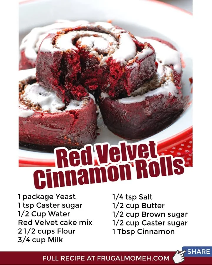 Delicious red velvet cinnamon rolls with cream cheese frosting on a plate.