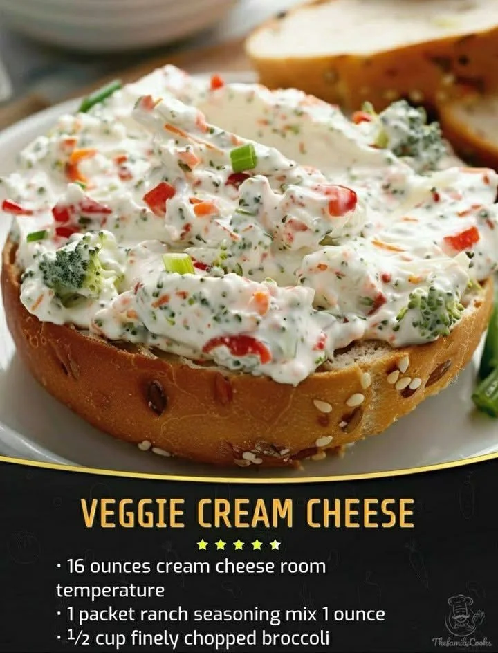 Vegetable Cream Cheese spread on a bagel with fresh veggies