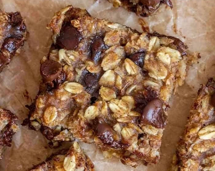 Delicious homemade banana oatmeal bars on a wooden cutting board