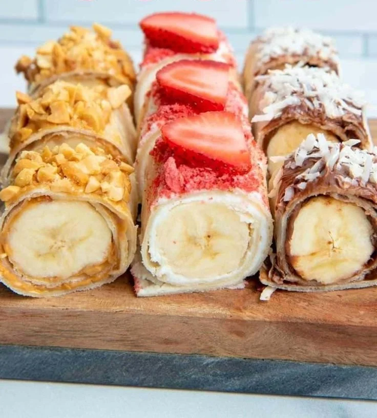 Delicious Banana Sushi rolls with nut butter and toppings on a plate.