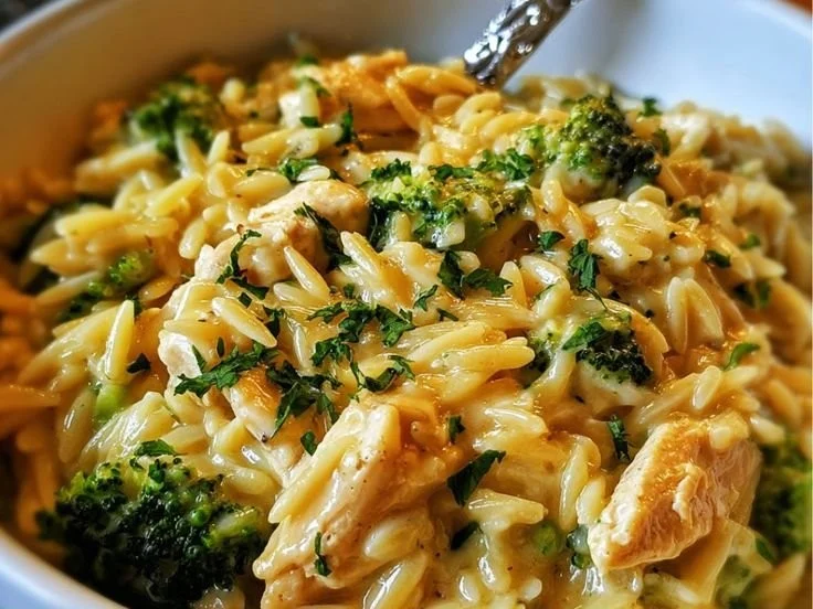 Delicious Cheesy Chicken Broccoli Orzo with creamy sauce and fresh broccoli