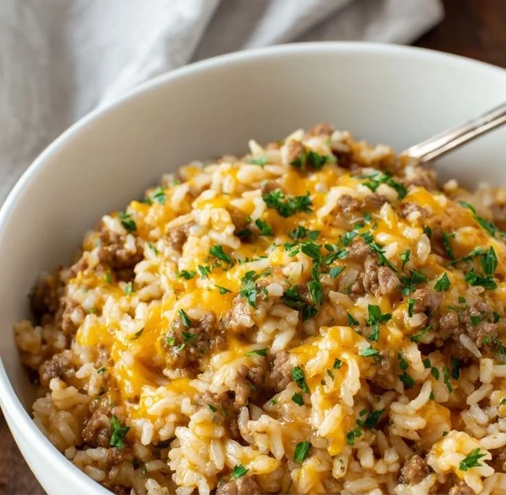 Cheesy Ground Beef and Rice Casserole served in a white dish