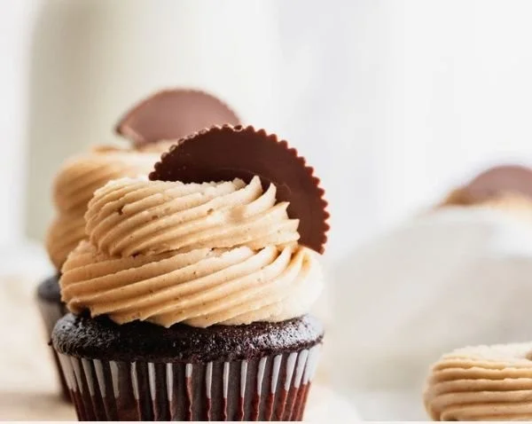 Delicious chocolate peanut butter cupcakes topped with creamy frosting.