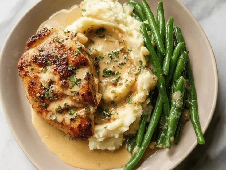 Creamy Garlic Parmesan Chicken breast garnished with herbs