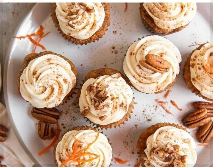 Delicious easy carrot cake cupcakes topped with cream cheese frosting