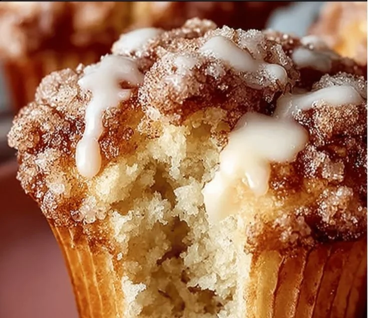 Easy coffee cake muffins fresh out of the oven with a crumb topping