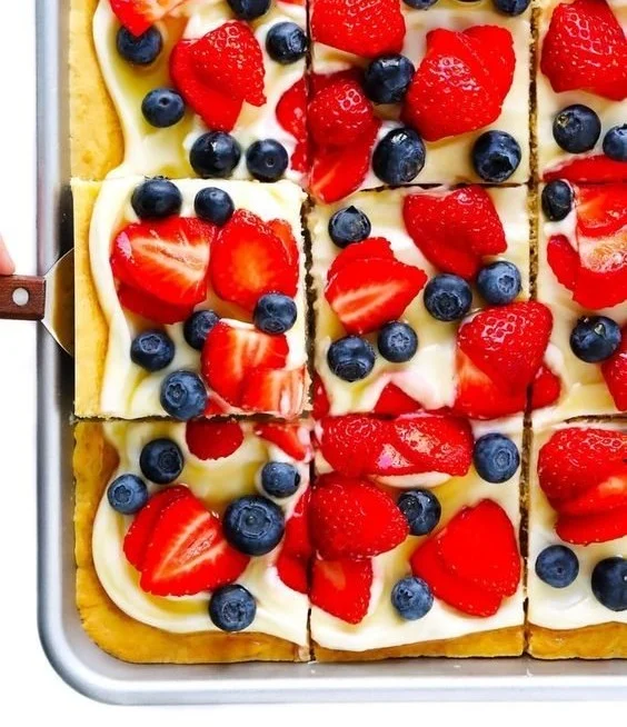 Delicious easy fruit pizza topped with fresh fruits and creamy frosting.