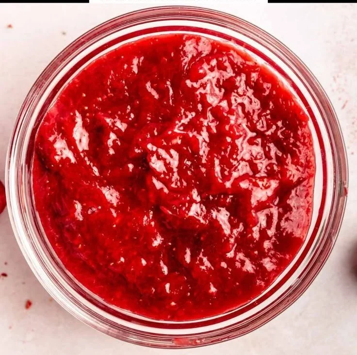 Homemade easy strawberry cake filling spread in a cake