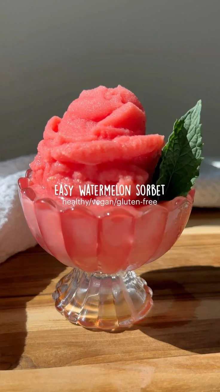 Bowl of easy homemade watermelon sorbet topped with mint leaves