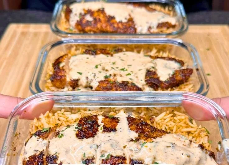 High Protein Creamy Cajun Chicken and Rice dish garnished and ready to serve.