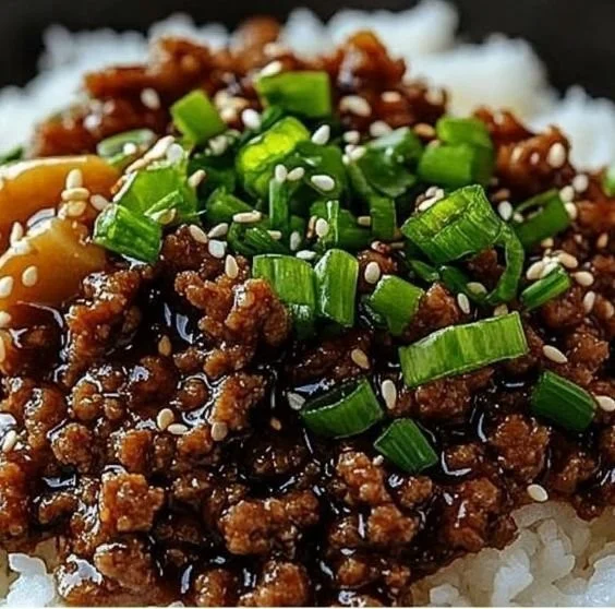 Korean Ground Beef Bowl topped with fresh vegetables and sesame seeds