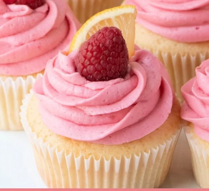 Lemon cupcakes with raspberry buttercream frosting elegantly displayed on a plate