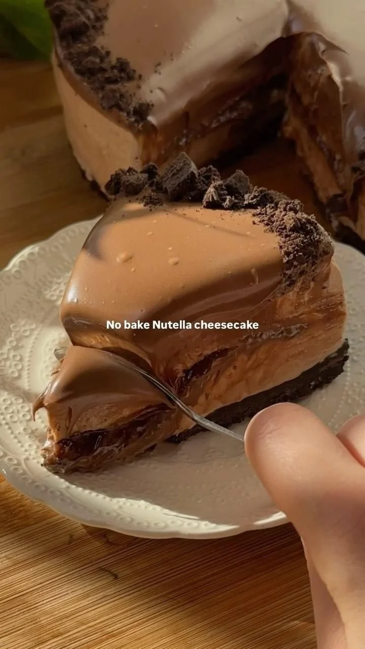 Delicious no bake Nutella cheesecake topped with chocolate and hazelnuts