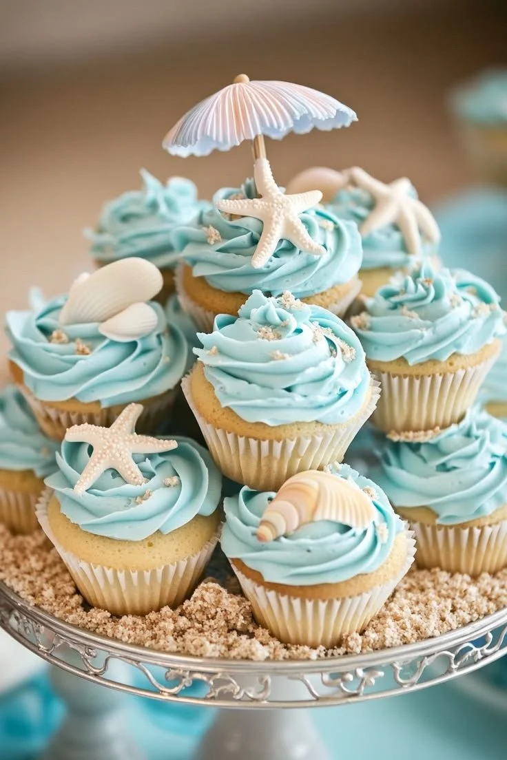 Ocean Breeze beach-themed cupcakes decorated with seashells and waves
