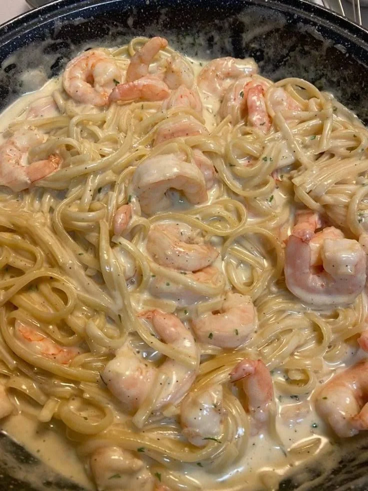 Delicious One Pan Shrimp Fettuccine Alfredo served with garnished parsley