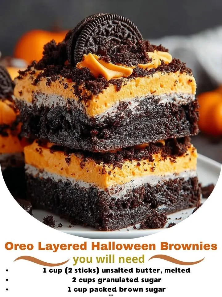 Oreo Layered Halloween Brownies with cream and chocolate toppings