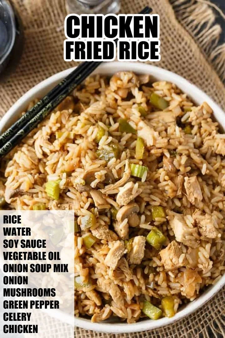 Plate of oven baked chicken fried rice with vegetables and chicken pieces