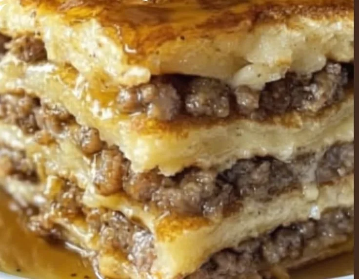 Delicious pancake sausage casserole served in a layered breakfast lasagna style