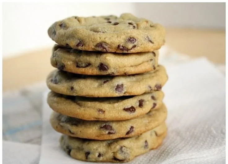 Perfect soft and chewy chocolate chip cookies on a baking tray