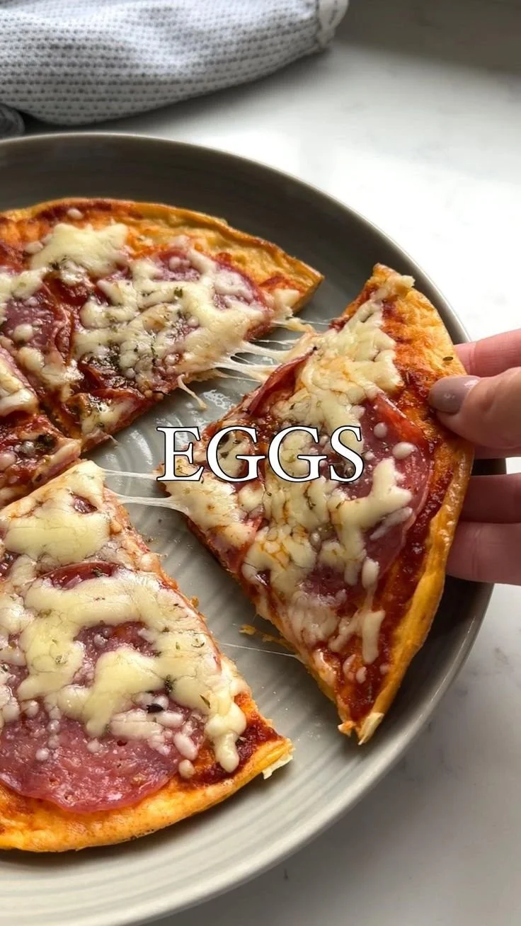 A delicious plate of Pizza Eggs topped with cheese and pepperoni.