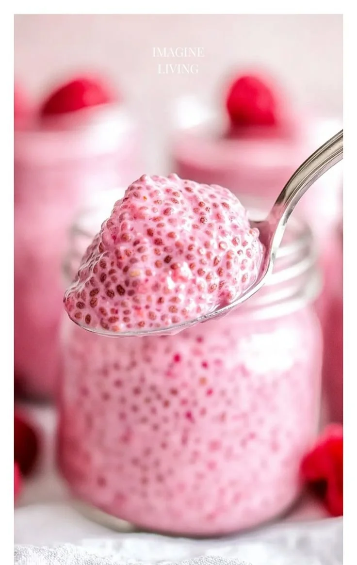 Delicious Raspberry Chia Pudding topped with fresh raspberries and maple syrup