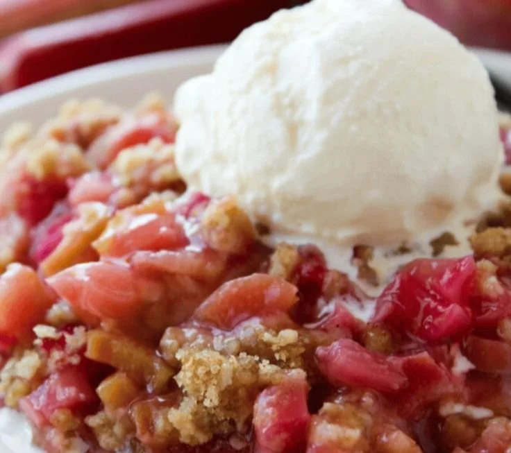 Delicious homemade Rhubarb Crisp served in a bowl with a crunchy topping.