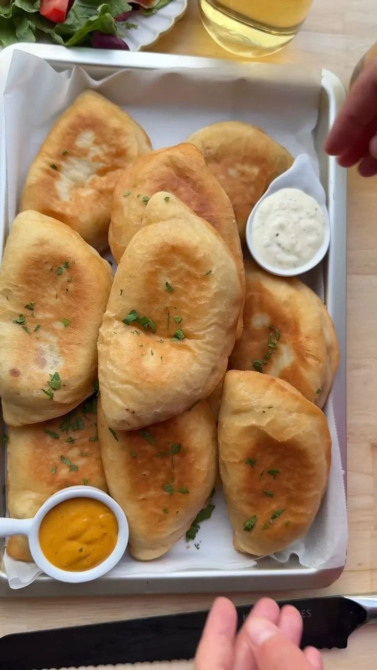 Delicious soft fried buns served with dipping sauce